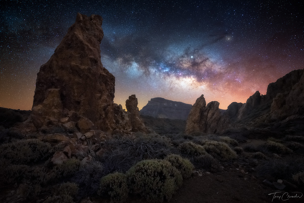 The Milky Way glides across the sky over a desert landscape in Teide National Park, Tenerife, Spain.