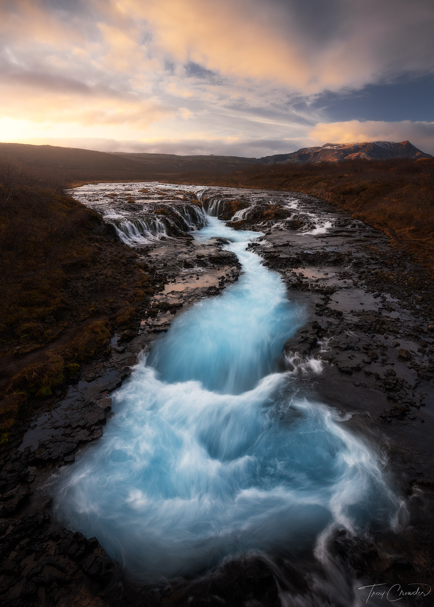 Fall colors and sunset light at Bruarfoss Waterfall in Southern Iceland.